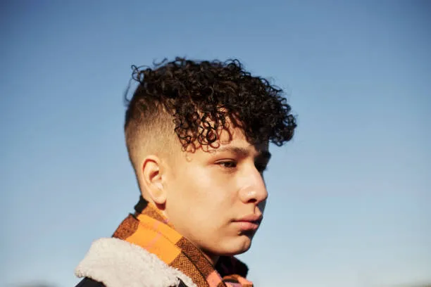 Thick Curly Mullet with Low Burst Fade